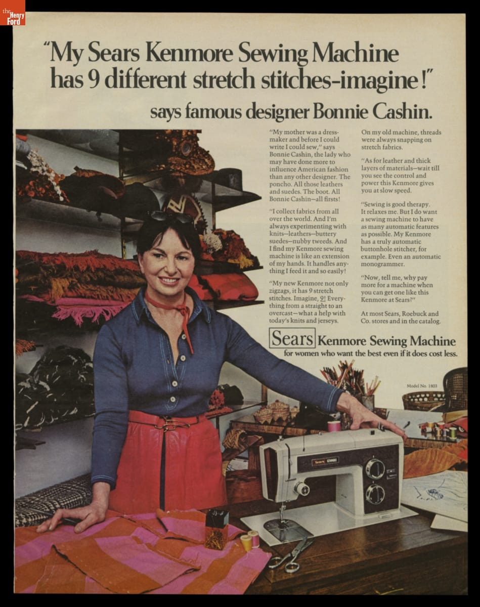Ad with text and photo of woman in blue denim shirt and red leather pants or skirt standing at table with sewing machine and fabric; more fabric is stacked on shelves behind her